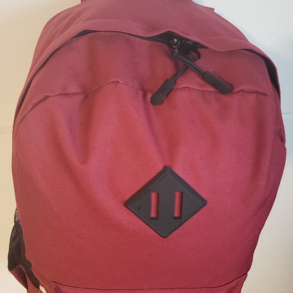 Bond Street Backpack red side stripes design white blue black pockets front hand - Picture 6 of 13